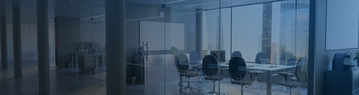 A conference room in an office building, overlaid with a blue gradient